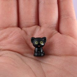 Black Cat with Tongue Poking Out
